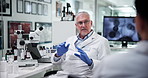 Mature scientist, man and team in discussion at lab for problem solving with medical research, dna or vaccine trial. People, group and leader with bacteria, virus or pharmaceutical study for solution