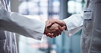 Handshake, medical and scientists in laboratory with partnership for pharmaceutical innovation. Agreement, science and professional biologists shaking hands for healthcare deal, collaboration or team