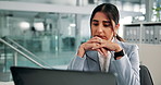 Laptop, reading and review with business woman at desk in office for administration or research.  Computer, information and planning with Indian employee in workplace for online feedback or report