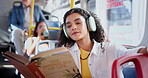Bus, headphones and woman with book in city for journey, commute and travel in urban town. Public transport, passenger and person reading on vehicle and listening to podcast, audiobook and recording