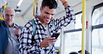 Happy man, phone and bus with handle for travel, road safety or social media in public transport. Male person, traveler or student with smile on mobile smartphone in vehicle for tourism, news or ride