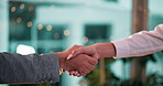 Handshake, business people and deal for agreement, support or company acquisition at night. Shaking hands, team and collaboration for partnership, merger and cooperation with bokeh in office closeup