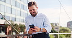Phone, happy and businessman in city for email, communication or contact with investment client. Cellphone, bridge and financial manager typing for social networking online with technology in town.