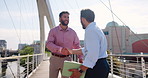 Meeting, handshake and business men in city for partnership, collaboration and greeting. Corporate, professional and people shaking hands for agreement, b2b networking and thank you in urban town