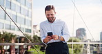 Cellphone, happy and businessman in city for email, communication or contact with investment client. Phone, bridge and financial manager typing for social networking online with technology in town.