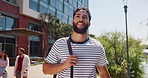 Travel, walking and man in city for vacation, holiday and sightseeing on trip with bag. Journey, commute and happy person outdoor for tourism, explore and thinking on adventure with vision on street