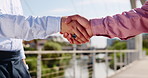 Handshake, deal and business men in city for negotiation with investment agreement in collaboration. Contract, greeting and male finance manager shaking hands with investor for corporate partnership.