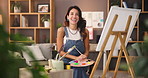 Woman, painter and smile with canvas in home with creative process, face and talent for project. Person, happy and artist with painting, color and craft with pride, portrait and excited in Argentina