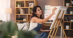 Woman, palette and artist with canvas in house with creative process, color and smile with project in studio. Person, painter and brush with stroke, drawing and design in living room at apartment