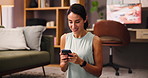 Typing, fitness and woman with smartphone, home and research for exercise routine, smile or living room. House, healthy and mature person with mobile for workout tips, happy or social media in lounge