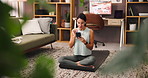 Happy, fitness and woman with smartphone, earphones and listening to music for exercise in morning. Streaming, calm and mature person with mobile for audio, workout and smile for song on web in house