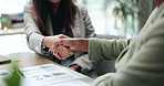 Collaboration, finance and handshake with business people in office for agreement or deal. Graphs, information and partnership with employee team shaking hands at work for success or thank you