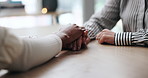 Therapist, people and holding hands for comfort, care and trust with kindness in clinic. Counseling, support and psychologist help with empathy for grief, console or connection with sympathy for loss