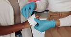 People, hands and bandage with gloves for first aid emergency, injury or paramedic service at clinic. Closeup, medical worker or strap with cotton or patient for bruise, wound or hospital healthcare