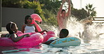 Bonding, relax and splash with friends in swimming pool together for holiday or vacation. Party, summer and water with group of happy people outdoor at hotel, lodge or resort for weekend getaway