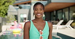 Happy, fashion and face of black woman by swimming pool for holiday, vacation and relax at resort. Sunglasses, style and portrait of girl in swimsuit outdoors with confidence, pride or smile by water