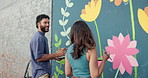 Wall art, friends and painting mural with advice for creativity, community project and student hobby. Woman, man and people for artist with diy decor, painter and flowers with expression outdoors