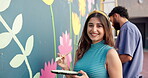 Wall art, woman and painting mural with face for creativity, community project and student hobby. Girl, smile and brush for artist people with diy decor, painter and flowers with expression outdoors