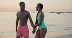 Holding hands, sunset or black couple at sea walking for vacation, anniversary or honeymoon holiday. Paradise, talking or romantic people bonding at beach together for travel, relationship or ocean
