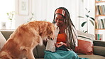 Teaching, treat and woman with dog at home for pet training, animal adoption and canine loyalty. Love, bonding and golden retriever with person in living room of house for puppy food, relax and care