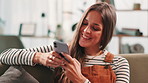 Smile, woman and texting with phone at house for communication, social media and reading blog. Female person, mobile app and contact for feedback, planning weekend and message update for notification
