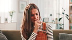 Sick, woman or coughing with illness on sofa for chest pain, asthma or respiratory infection at home. Female person, cold or flu with symptoms of virus for pneumonia, bronchitis or allergies at house