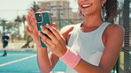 Sports, laugh and happy woman with phone on tennis court for social media, online chatting and internet. Athlete, fitness and person on smartphone typing after training, exercise and workout for game
