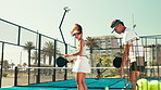 Padel tennis, coaching and sports with people on court for competition, training and teaching. Game, workout and fitness club with man and woman learning for athlete, practice and racket tournament