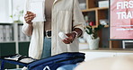 Person, paramedic and presentation with first aid kit for healthcare training or emergency service at office. Closeup, trainer or health coach with screen, bandage or equipment for safety lesson