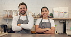 Face, people and barista in cafe, arms crossed and support with cooperation, friendly service and smile. Portrait, coworking and employees in coffee shop, teamwork and hospitality with restaurant