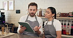 People, waiter and talk with tablet at cafe for online order, staff training and inventory management. Man, woman and discussion with digital for stock check, menu update and feedback of performance