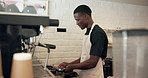 Man, barista and cleaning portafilter by coffee machine for hygiene, service and dirt removal in small business. African person, cafe and wipe tools with cloth, portaholder and equipment with water
