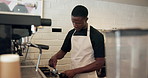 Portafilter, black man and barista prepare coffee for service, latte and espresso in small business. Cafe, process and person by machine for making beverage, morning brew and mixing ground beans