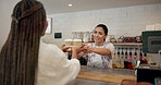 Happy, coffee and barista with customer in cafe with hospitality, service or helping in morning. POS, women and waitress with client for latte, cappuccino or caffeine in restaurant for small business