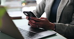 Business woman, hands and phone at desk with networking, text and online communication. Laptop, mobile message and social media browse in office or workplace with contact and typing at company