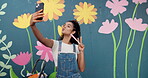 Artist, selfie and woman with smile, painting and photography of wall art for memory and confident. Mural, painter and person with picture for social media, influencer and peace sign for artwork
