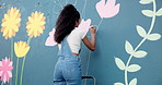 Art, woman and painting on wall with ladder for creative design, flower decor and volunteer. Artist, girl and painter outdoor with brush for community mural, floral color and back for charity project