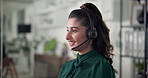Happy woman, consultant and talking with headset at call center for online communication or advice. Female person, employee or agent with technology or app for customer service, help or telemarketing