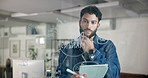 Businessman, writing and thinking with tablet on glass board for mindmap, planning or brainstorming at office. Man, employee or planner taking notes with technology for project ideas at workplace