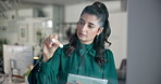 Business woman, writing or thinking with tablet on glass board for mindmap, planning or brainstorming at office. Female person, employee or taking notes with technology for project ideas at workplace