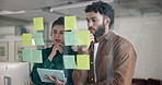 Business people, thinking or planning with tablet for brainstorming on glass board at office. Businessman, woman or thoughtful employees in wonder with schedule for project idea together at workplace