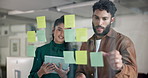 Business people, sticky note and planning with tablet for brainstorming on glass board at office. Businessman, woman or designers with schedule or technology for project ideas together at workplace