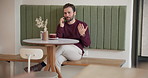 Man, phone call and happy with talk at cafe, listen and networking for funding opportunity for entrepreneurship. Person, smartphone and excited for deal, investment and small business at coffee shop
