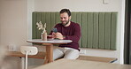 Man, happy and phone typing in cafe for text message response, social media post and dating site app. Relax, person and smile with smartphone in restaurant for coffee break and internet connection