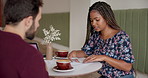 Coffee shop, talking and business people with documents for meeting, discussion and proposal. Startup, restaurant and man and woman with paperwork for project, collaboration and partnership in cafe