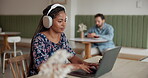 Woman, headphones and typing on laptop at cafe for remote work, email feedback and streaming podcast. African person, online research and writing article, listening to music and editing story at shop