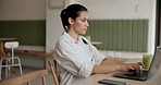 Woman, laptop and remote work at cafe for typing, review or schedule for project management at diner. Person, virtual assistant and pc for admin, contact or feedback with proposal at coffee shop