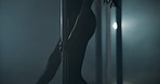 Exotic, dancing and person in nightclub, pole and dancer with balance for show, talent and career. Flexibility, artist and performer with elegance for event, active and performance with outfit
