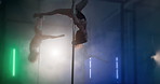 Stage, night and pole dance with woman in smoke for sensual art, performance and movement. Body, sexy and burlesque dancer with lights, collaboration and neon lingerie show at entertainment club 

