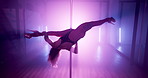 Neon light, pole dancing and woman in nightclub, sexy and exotic choreography. Erotic dancer, acrobatic performance and girl moving with flexibility, burlesque and spin for show with sensual art